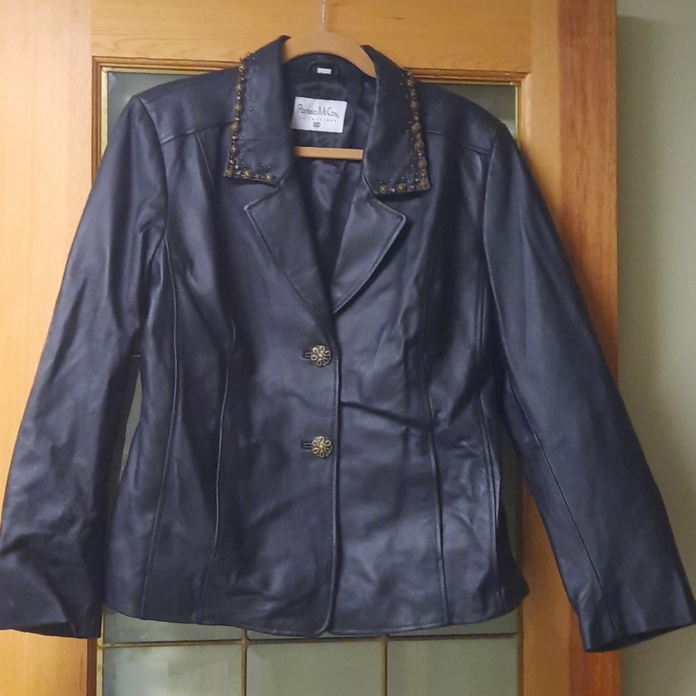 Black leather jacket with jewelry trim detailing